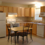 Townhouse Apartment kitchen area including fridge, stove, dishwasher, and microwave